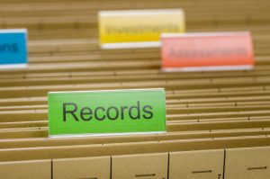 A hanging file folder labeled with Records