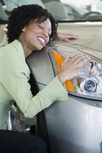 Woman hugging her car